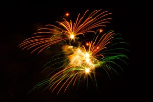 Fun orange, green, and gold Disneyland fireworks